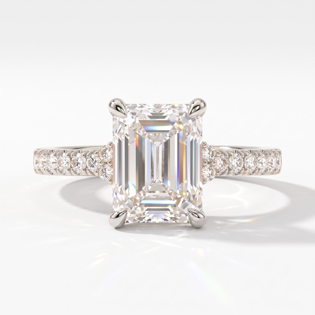Emerald cut lab-grown diamond hidden halo collar engagement ring with pavé band in 14K (585) white gold, front view