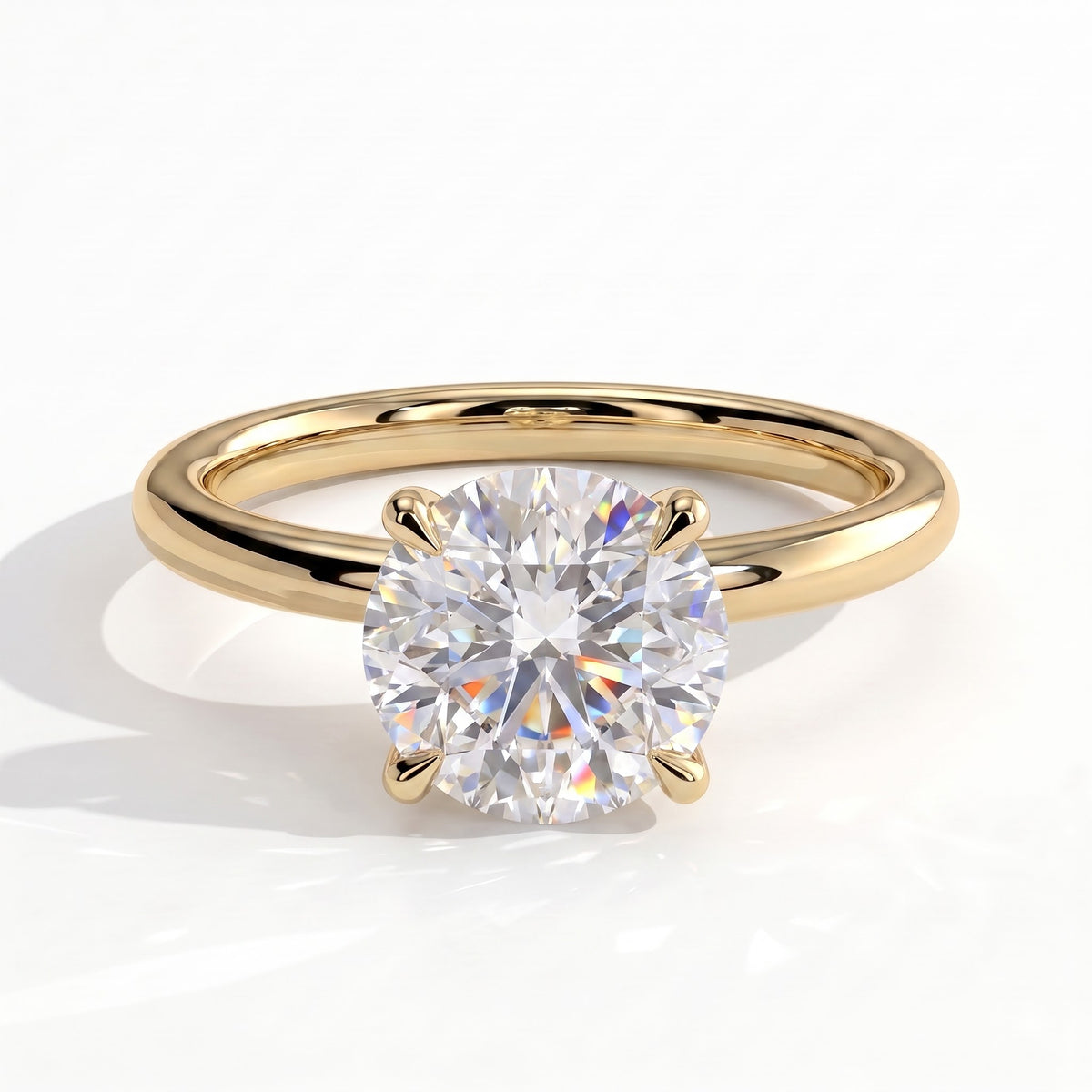 Round lab-grown diamond solitaire engagement ring in 14K (585) yellow gold, front view