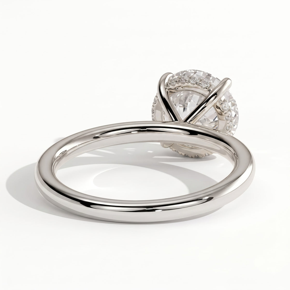 Round lab-grown diamond solitaire engagement ring in 14K (585) white gold, on white background