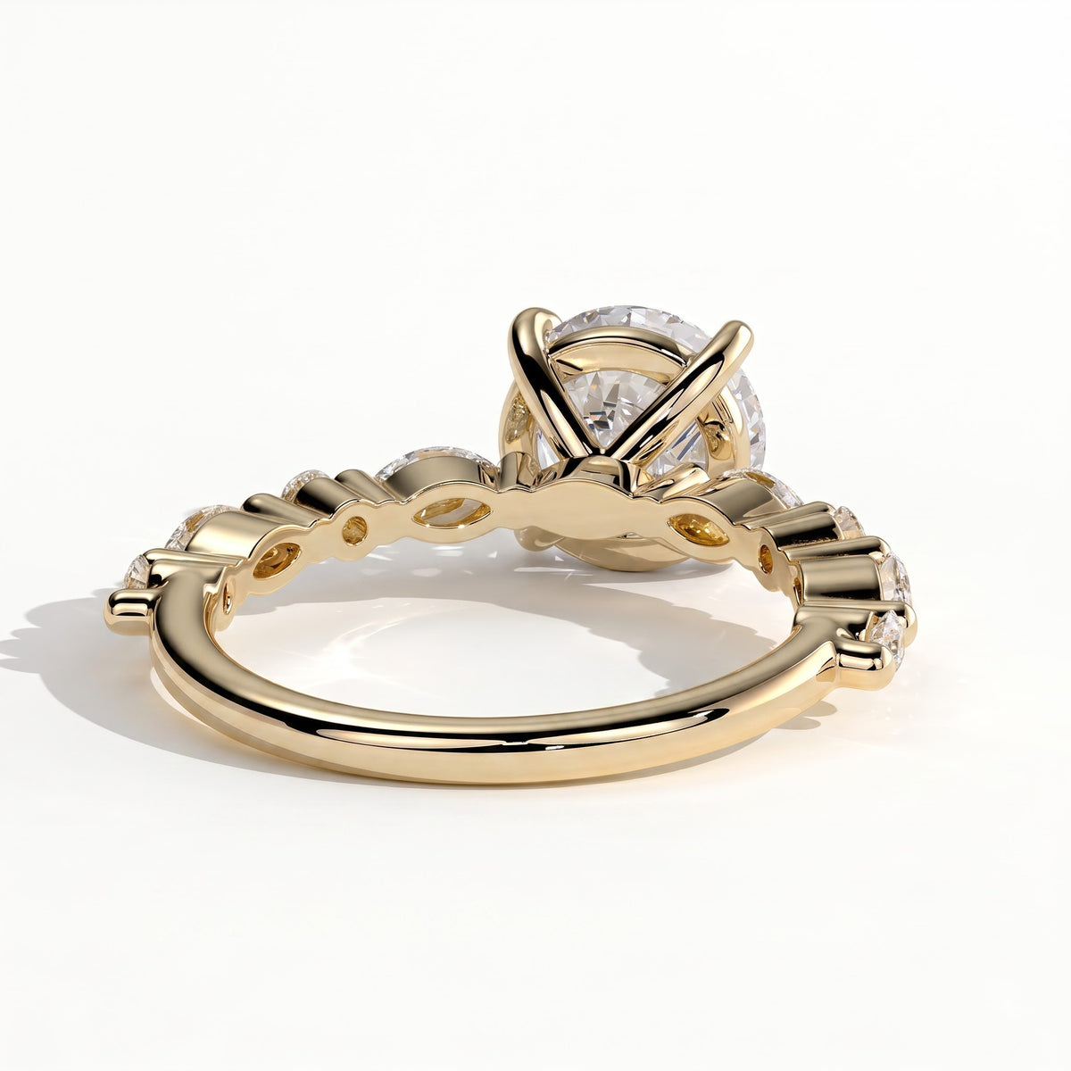 Round lab-grown diamond halo engagement ring in 14K (585) yellow gold, on white background
