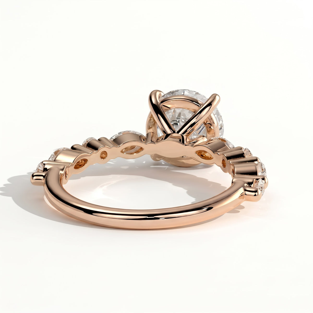 Round lab-grown diamond halo engagement ring in 18K (750) rose gold, on white background