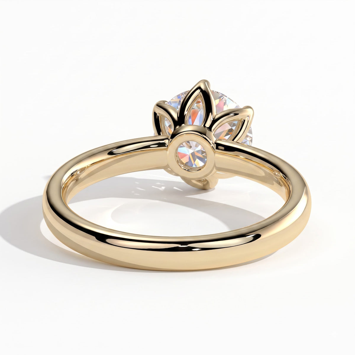 Round lab-grown diamond solitaire engagement ring in 18K (750) yellow gold, on white background