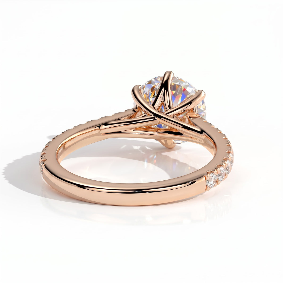 Round lab-grown diamond halo engagement ring in 18K (750) rose gold, on white background