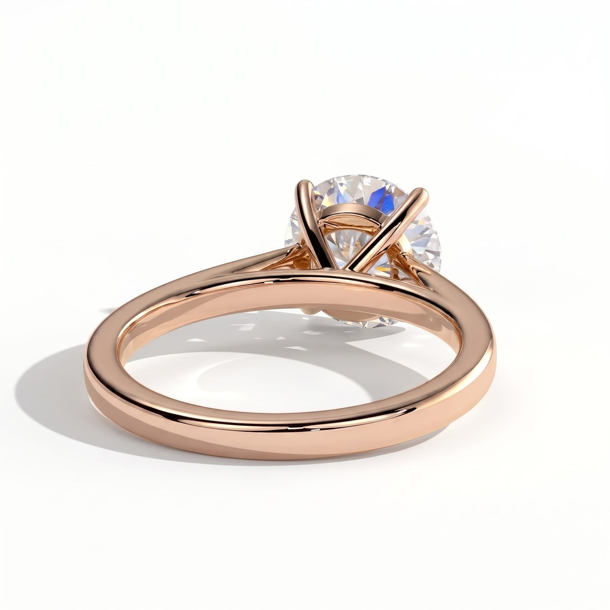 Round lab-grown diamond halo engagement ring in 14K (585) rose gold, on white background
