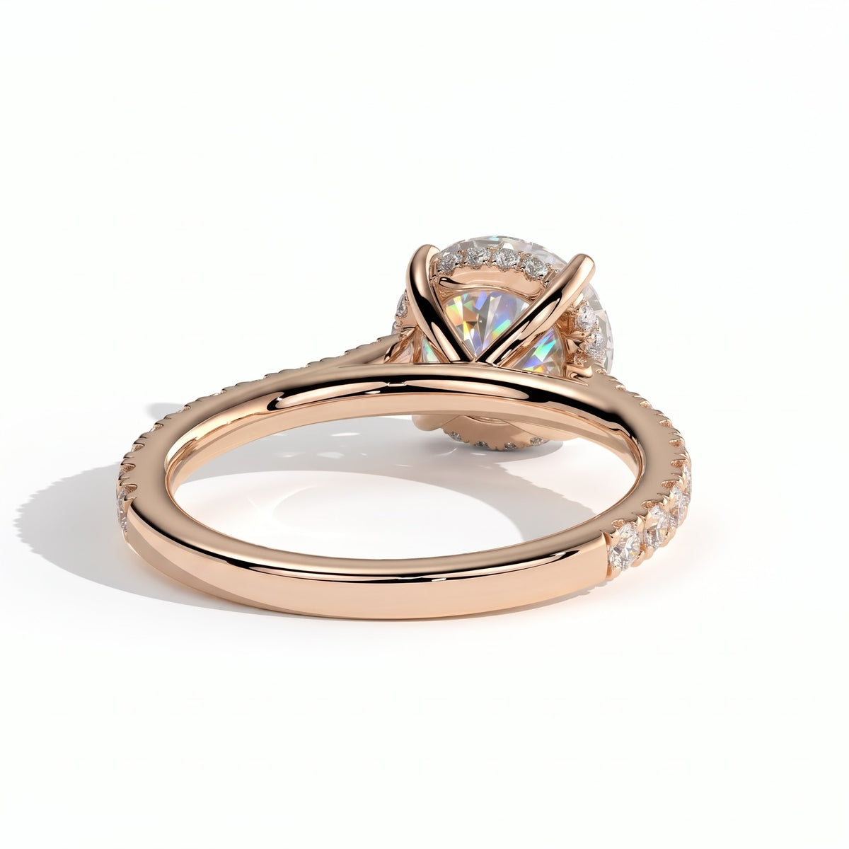Round lab-grown diamond halo engagement ring in 18K (750) rose gold, on white background