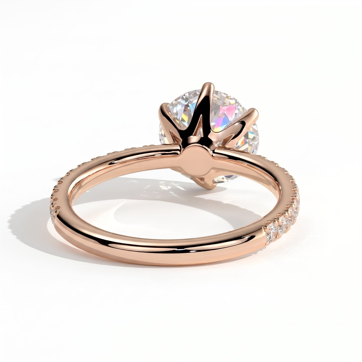 Round lab-grown diamond halo engagement ring in 14K (585) rose gold, on white background