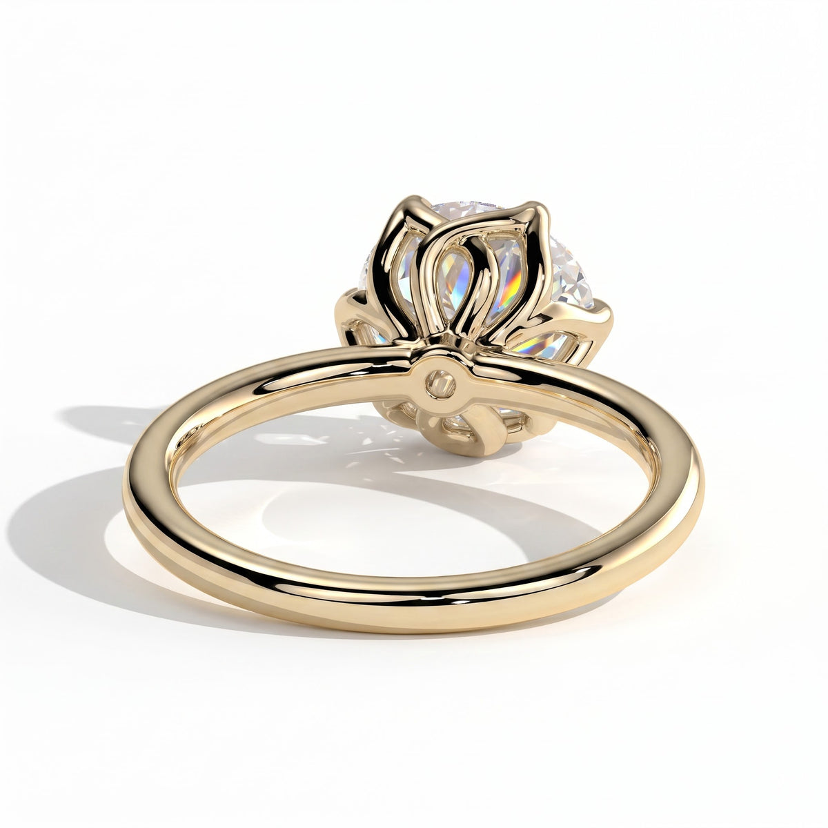 Round lab-grown diamond halo engagement ring in 18K (750) yellow gold, on white background