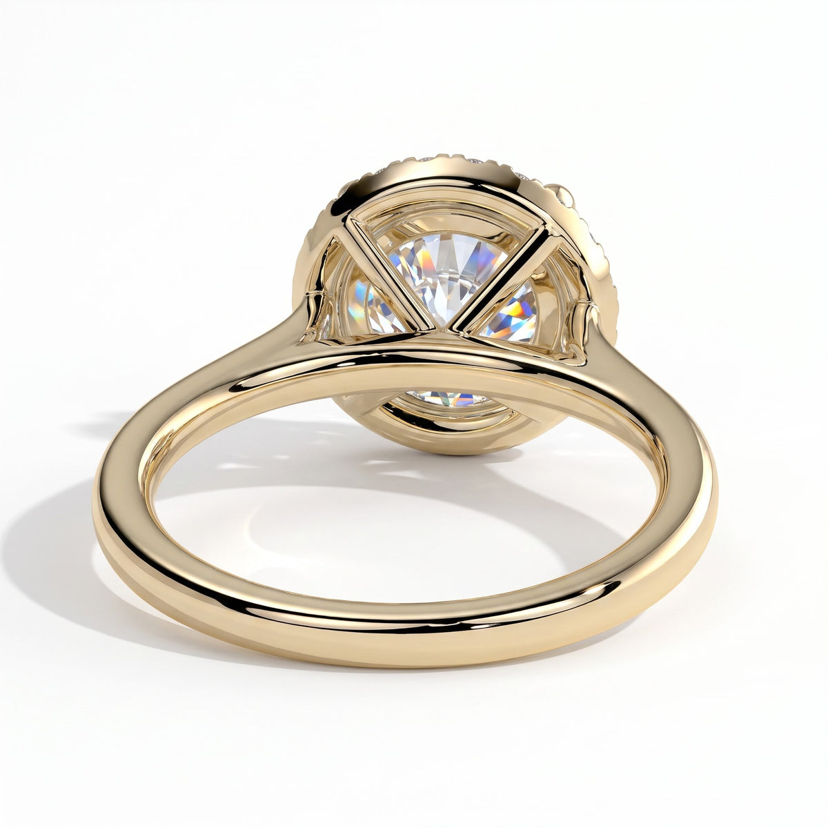 Round lab-grown diamond halo engagement ring in 14K (585) yellow gold, on white background
