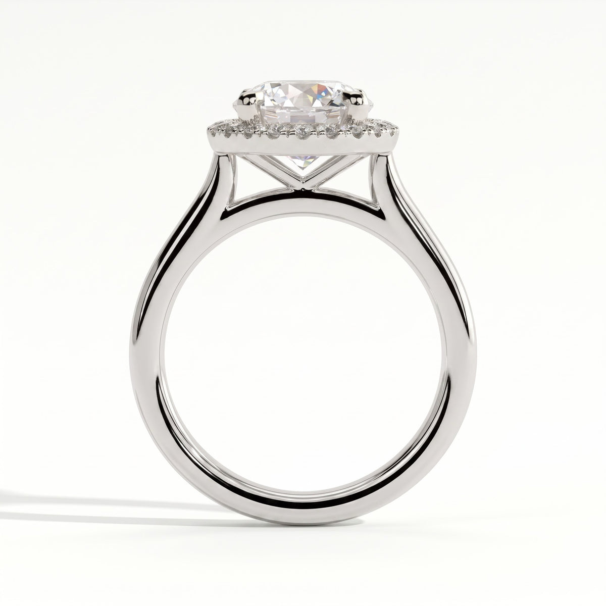 Round lab-grown diamond halo engagement ring in 950 platinum, side profile