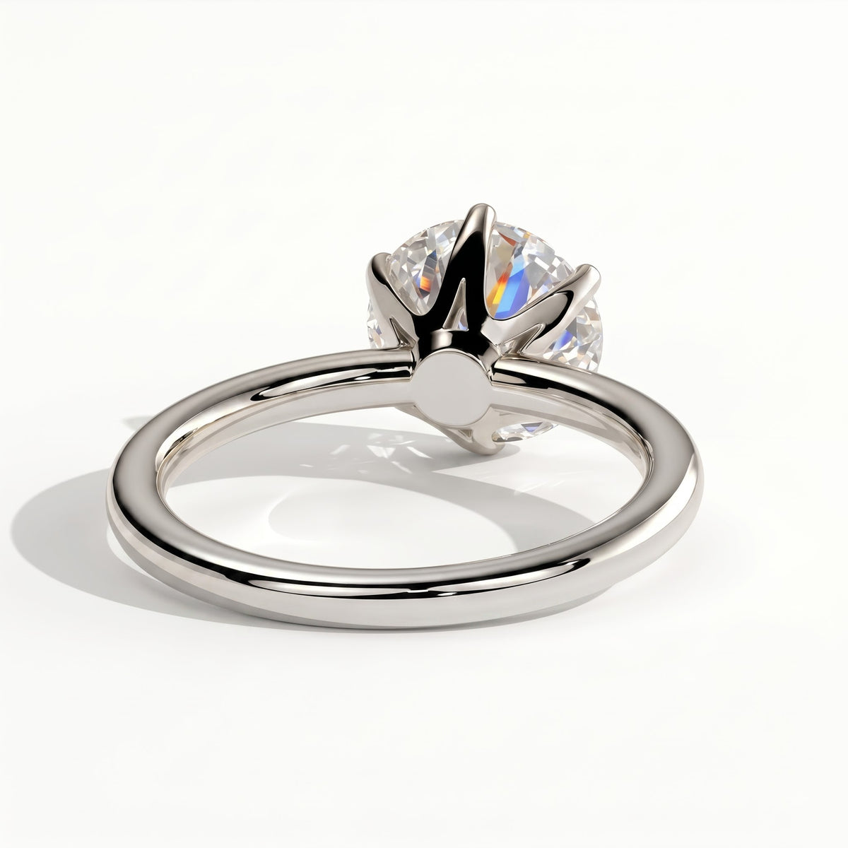 Round lab-grown diamond solitaire engagement ring in 950 platinum, on white background