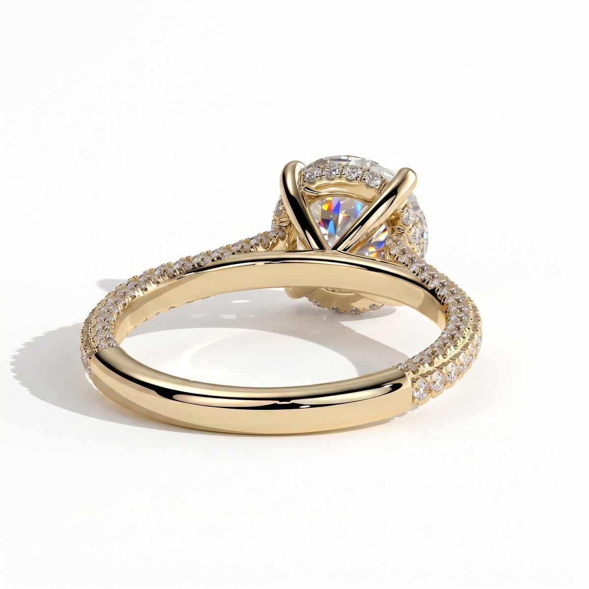Round lab-grown diamond halo engagement ring in 18K (750) yellow gold, on white background