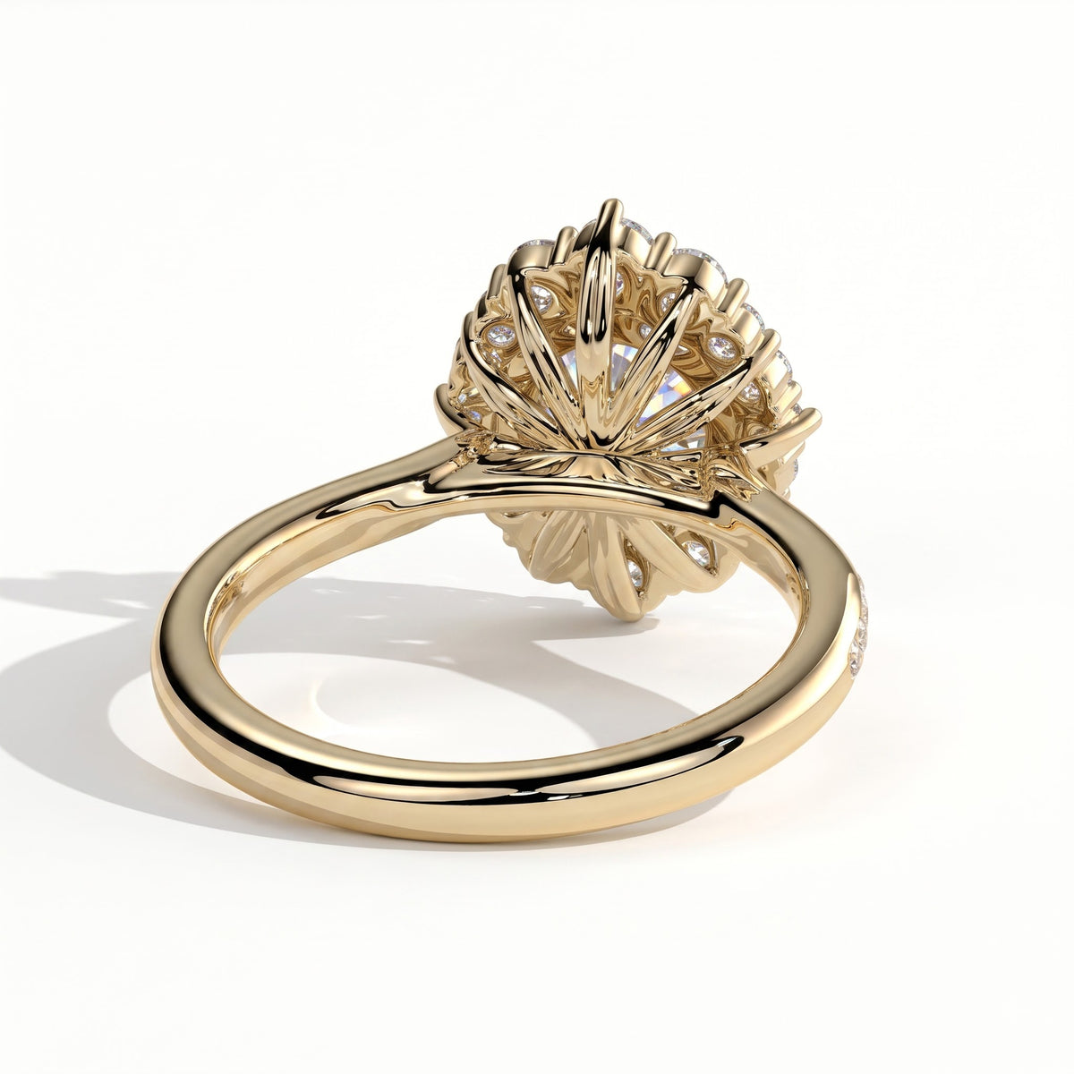 Round lab-grown diamond halo engagement ring in 18K (750) yellow gold, on white background