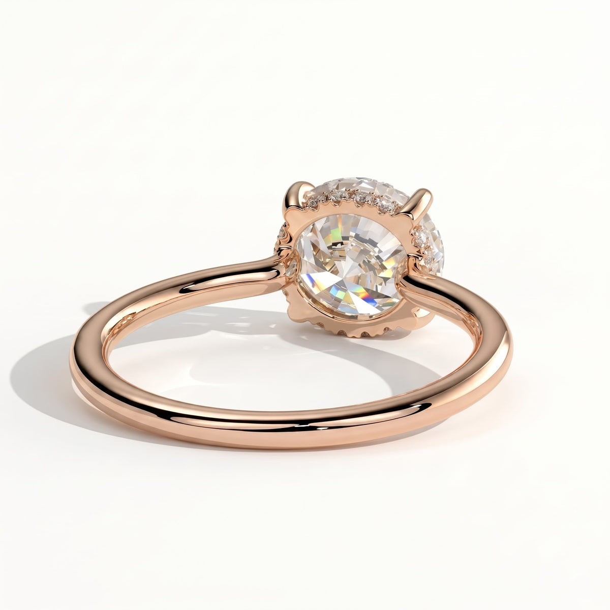 Round lab-grown diamond solitaire engagement ring in 18K (750) rose gold, on white background