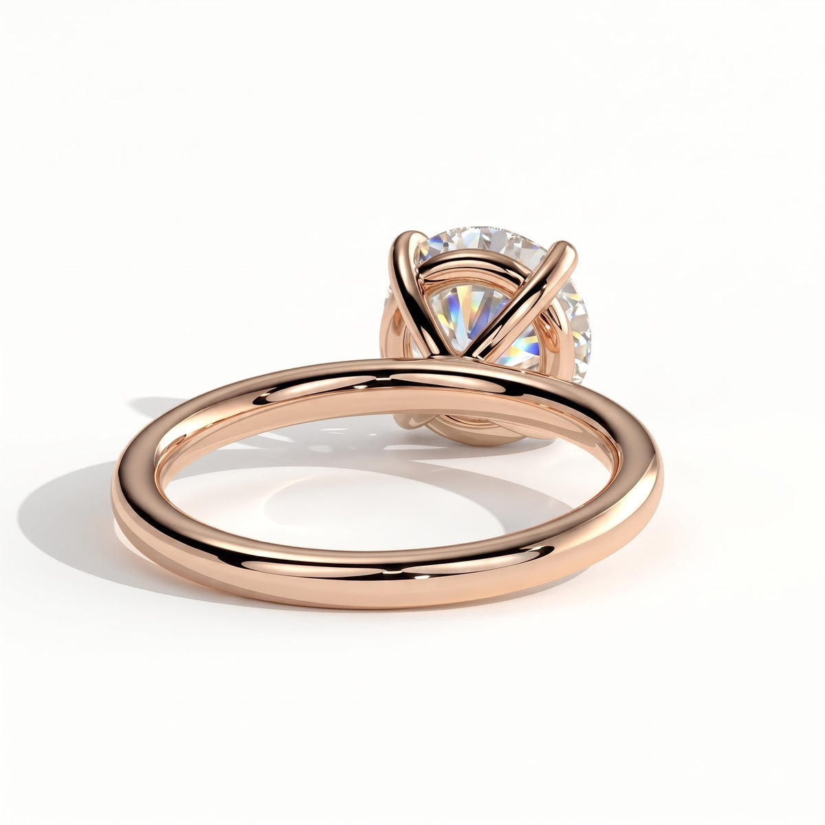 Round lab-grown diamond halo engagement ring in 14K (585) rose gold, on white background