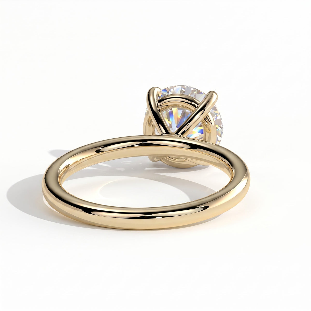 Round lab-grown diamond halo engagement ring in 18K (750) yellow gold, on white background