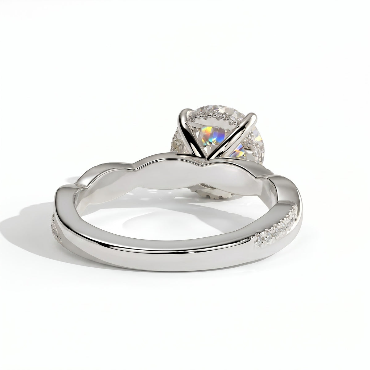 Round lab-grown diamond halo engagement ring in 950 platinum, on white background