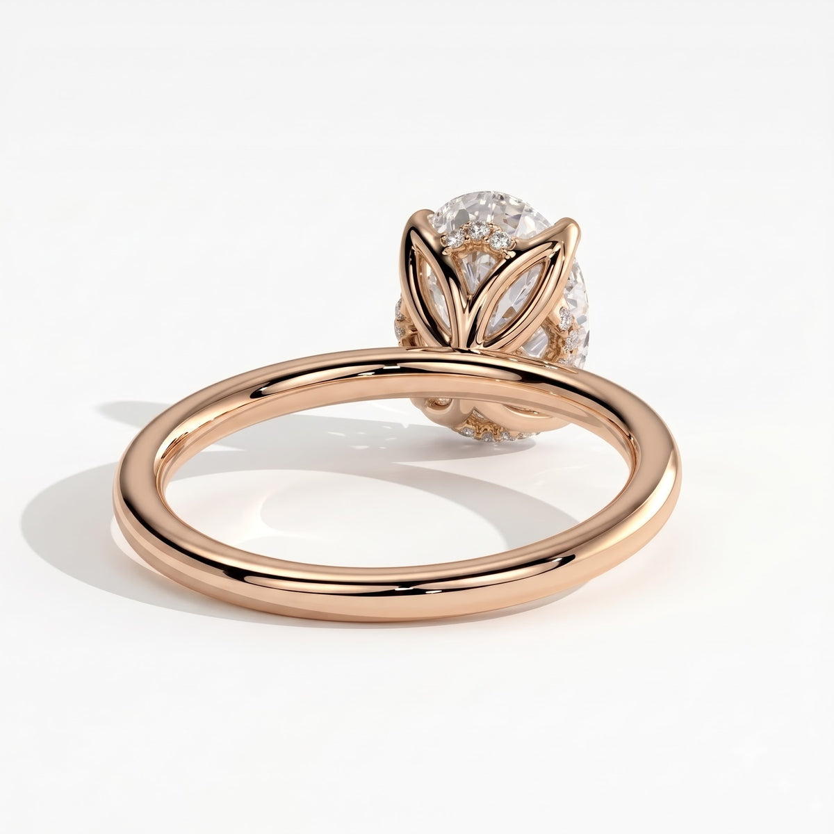 Oval lab-grown diamond solitaire engagement ring in 18K (750) rose gold, on white background