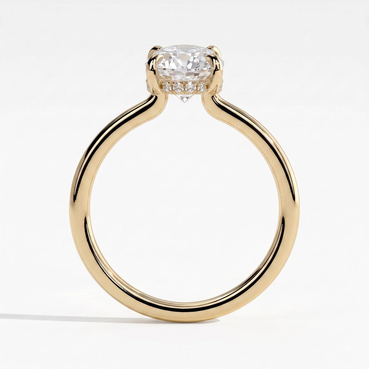 Oval lab-grown diamond solitaire engagement ring in 14K (585) yellow gold, side profile