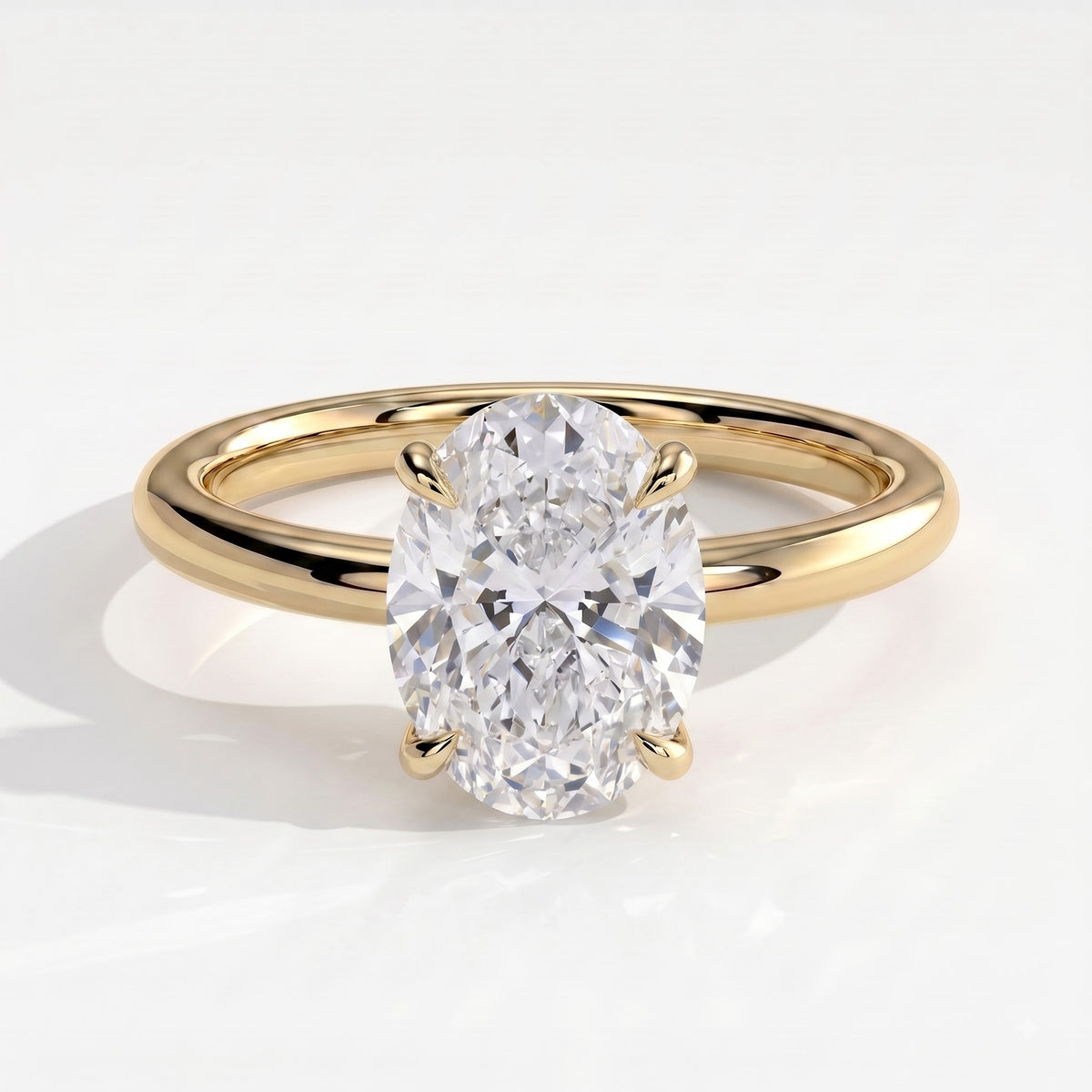 Oval lab-grown diamond solitaire engagement ring in 18K (750) yellow gold, front view