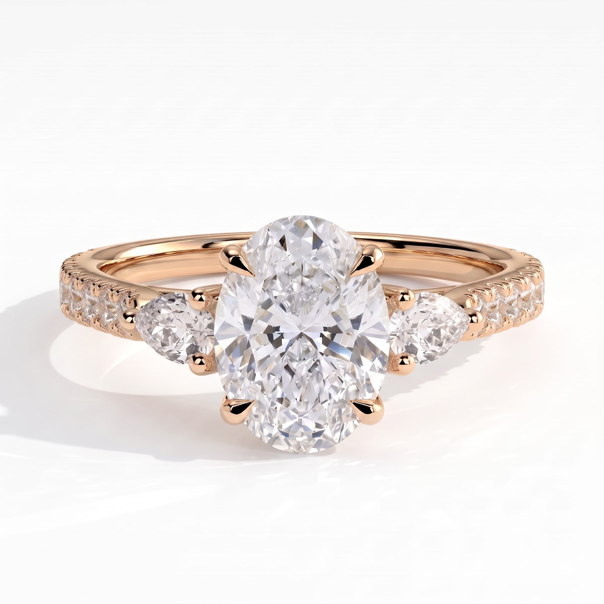 Oval lab-grown diamond three-stone engagement ring in 14K (585) rose gold, front view