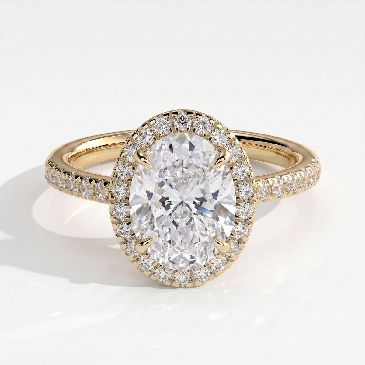 Oval lab-grown diamond halo engagement ring in 14K (585) yellow gold, front view