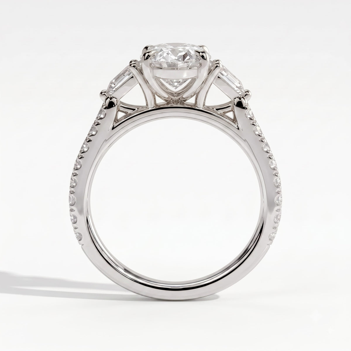Oval lab-grown diamond three-stone engagement ring in 18K (750) white gold, side profile