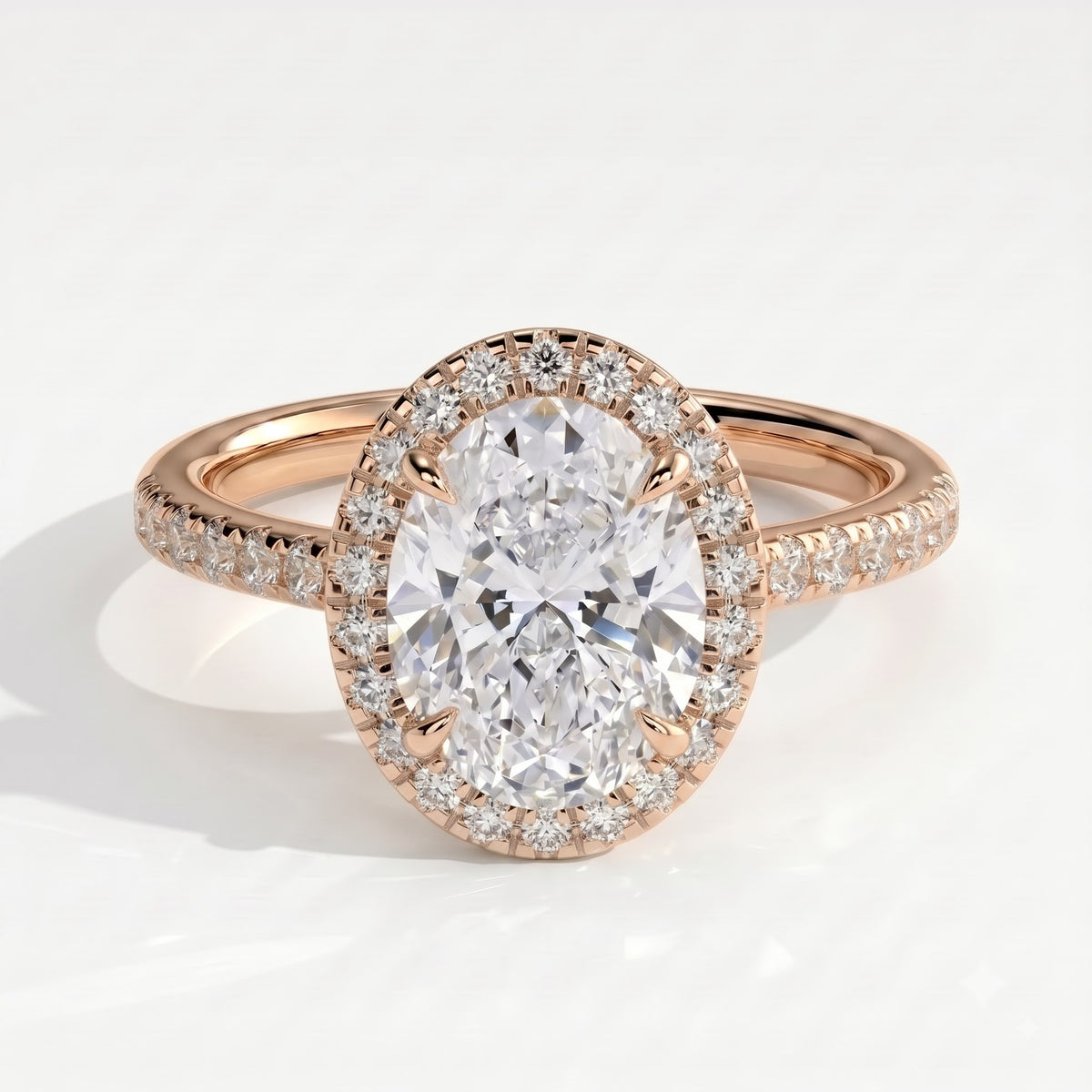 Oval lab-grown diamond halo engagement ring in 18K (750) rose gold, front view