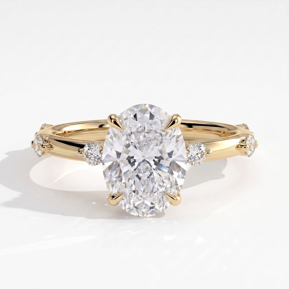 Oval lab-grown diamond halo engagement ring in 18K (750) yellow gold, front view