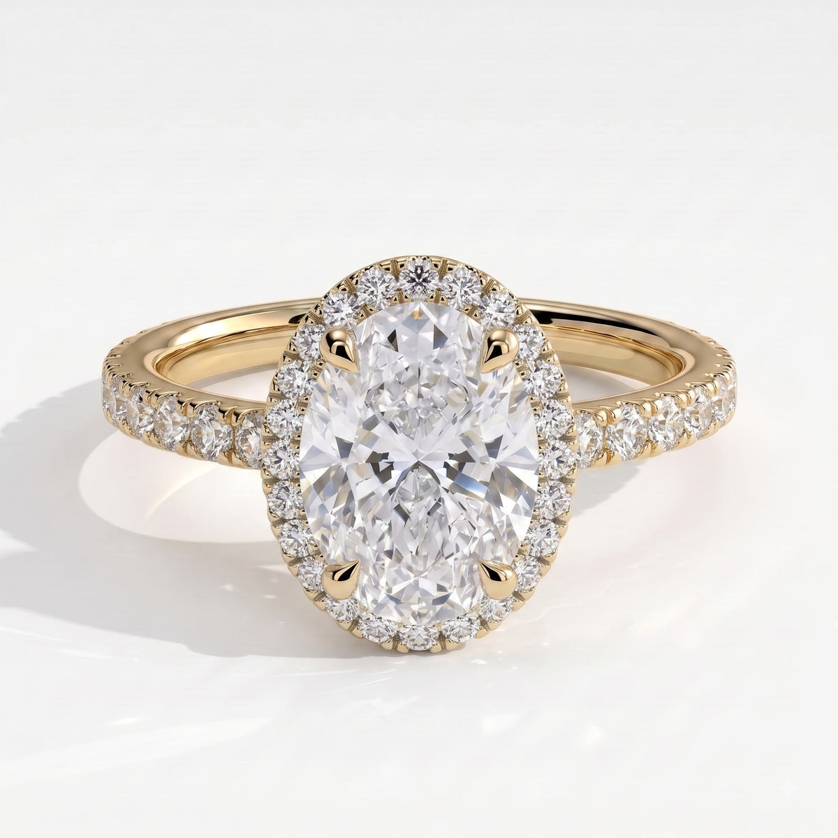 Oval lab-grown diamond halo engagement ring in 18K (750) yellow gold, front view