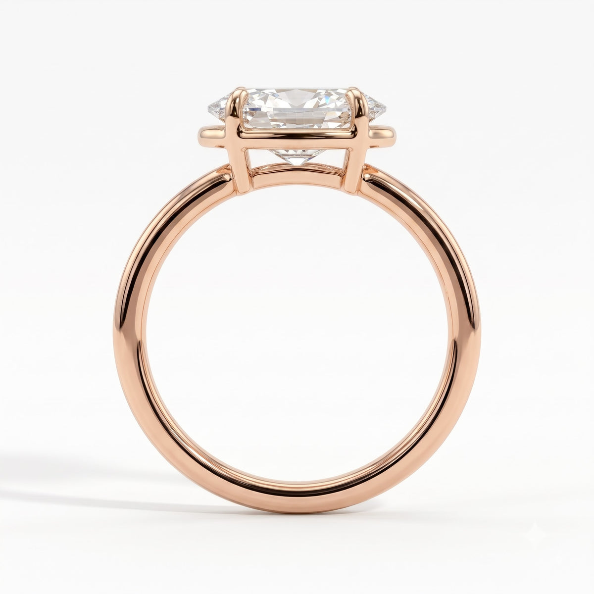 Oval lab-grown diamond bezel-set east-west solitaire engagement ring in 18K (750) rose gold, side profile