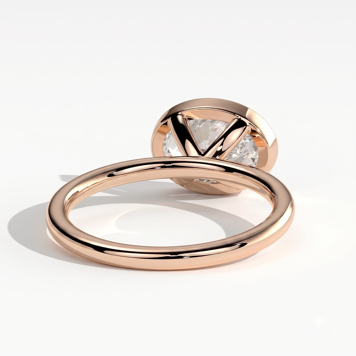 Oval lab-grown diamond bezel-set east-west solitaire engagement ring in 14K (585) rose gold, on white background