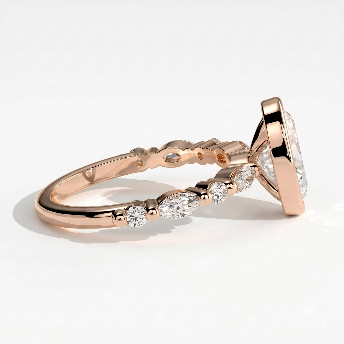 Oval lab-grown diamond bezel-set halo engagement ring in 18K (750) rose gold, detail view