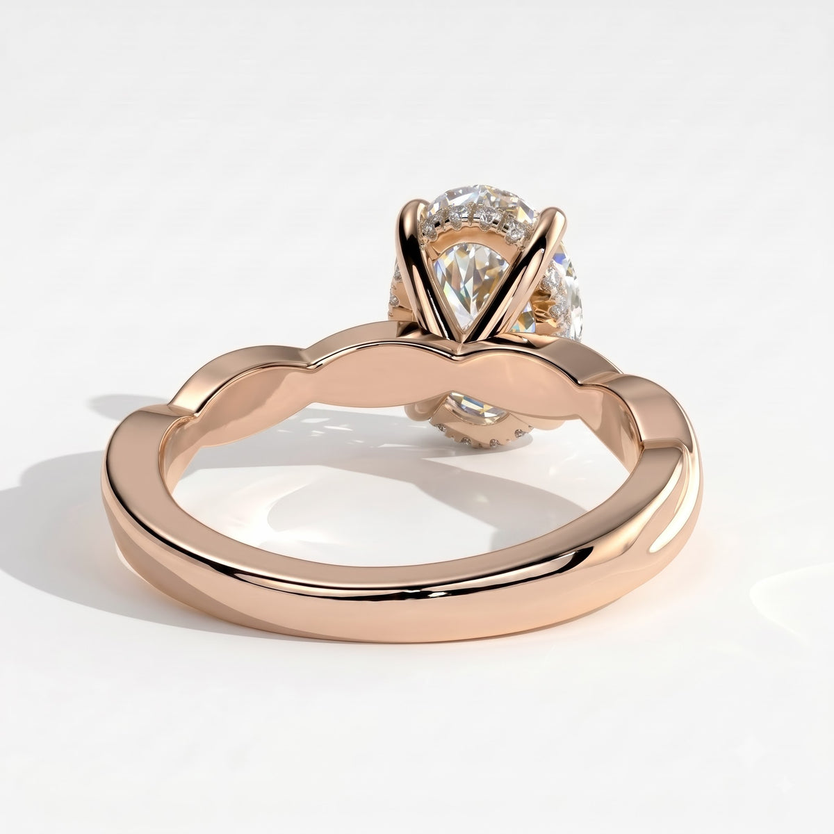 Oval lab-grown diamond solitaire engagement ring in 14K (585) rose gold, on white background
