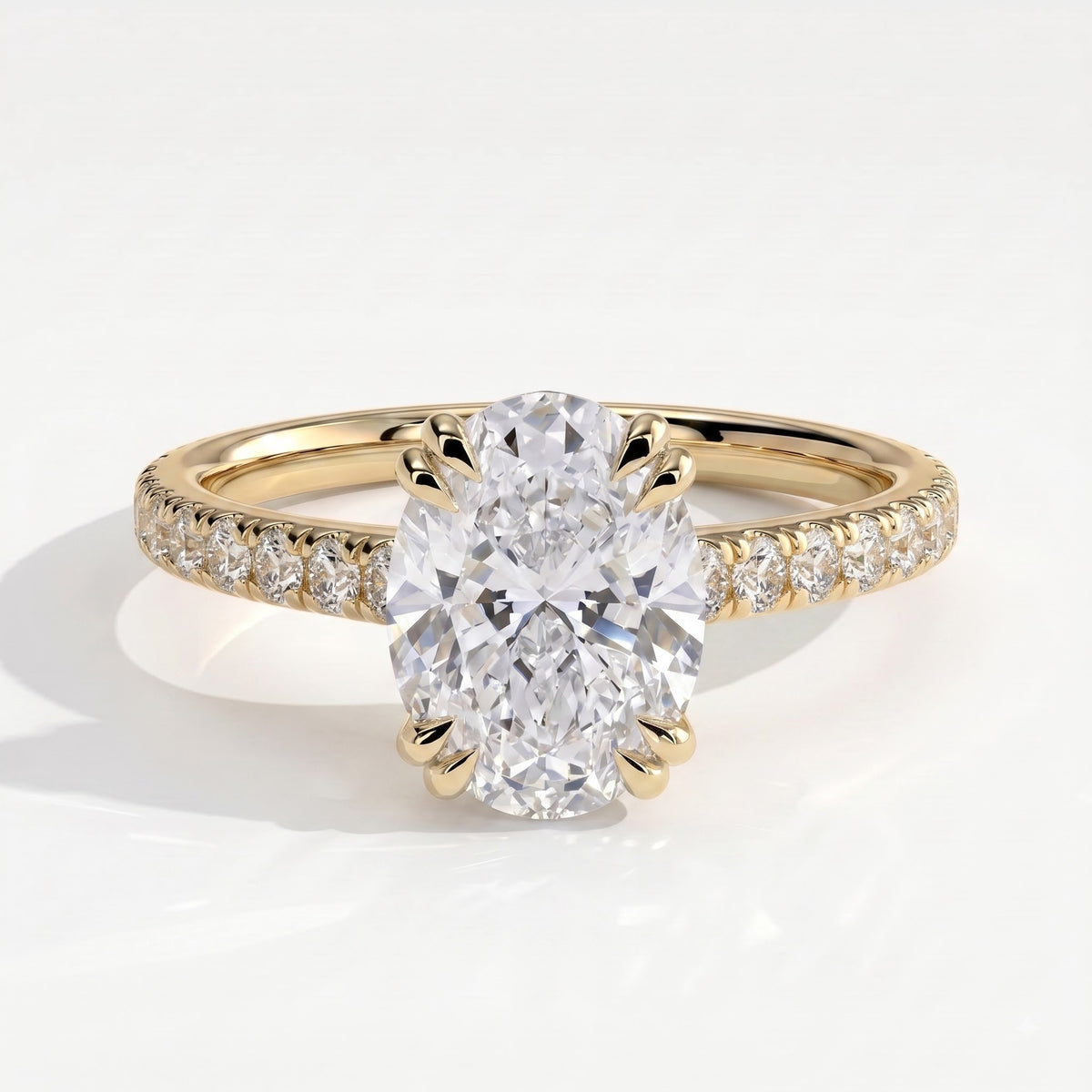 Oval lab-grown diamond halo engagement ring in 14K (585) yellow gold, front view