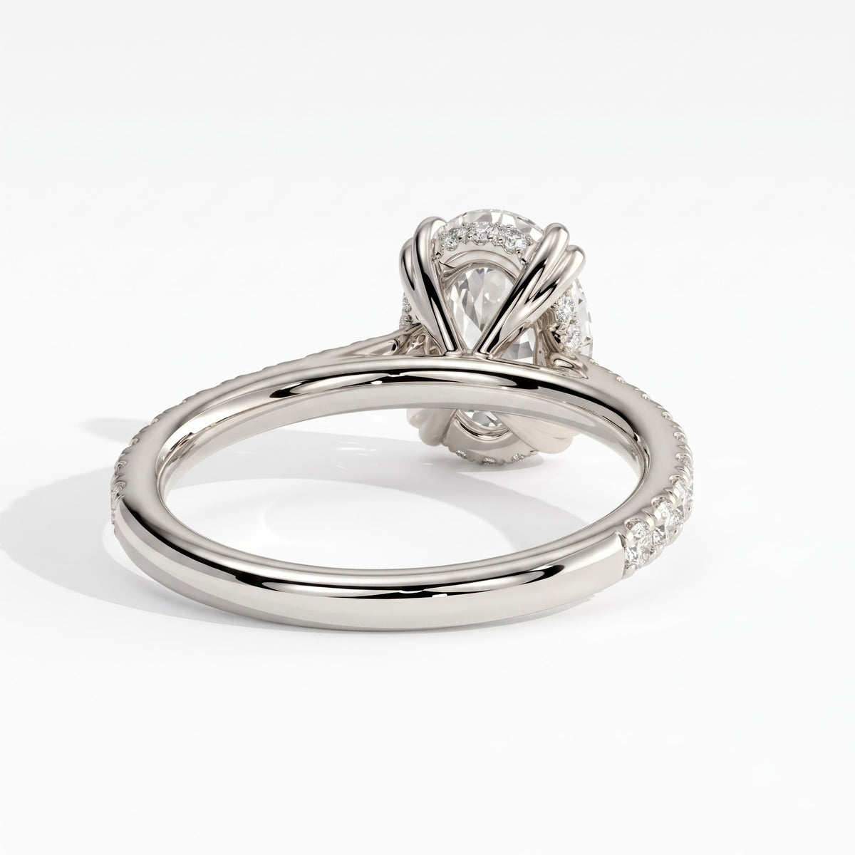 Oval lab-grown diamond halo engagement ring in 14K (585) white gold, on white background