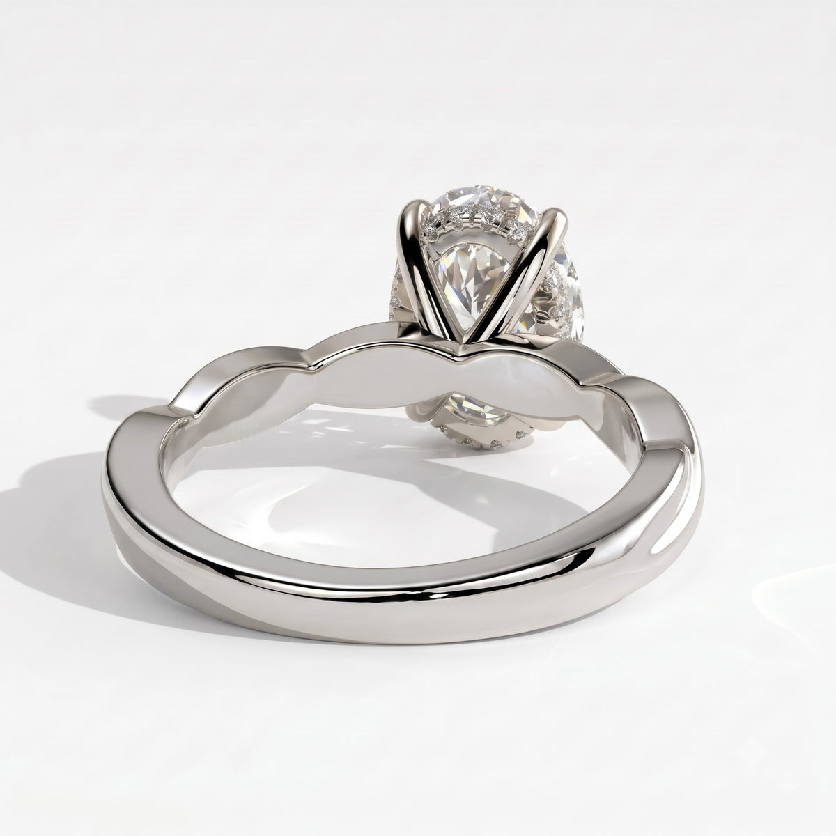 Oval lab-grown diamond solitaire engagement ring in 18K (750) white gold, on white background