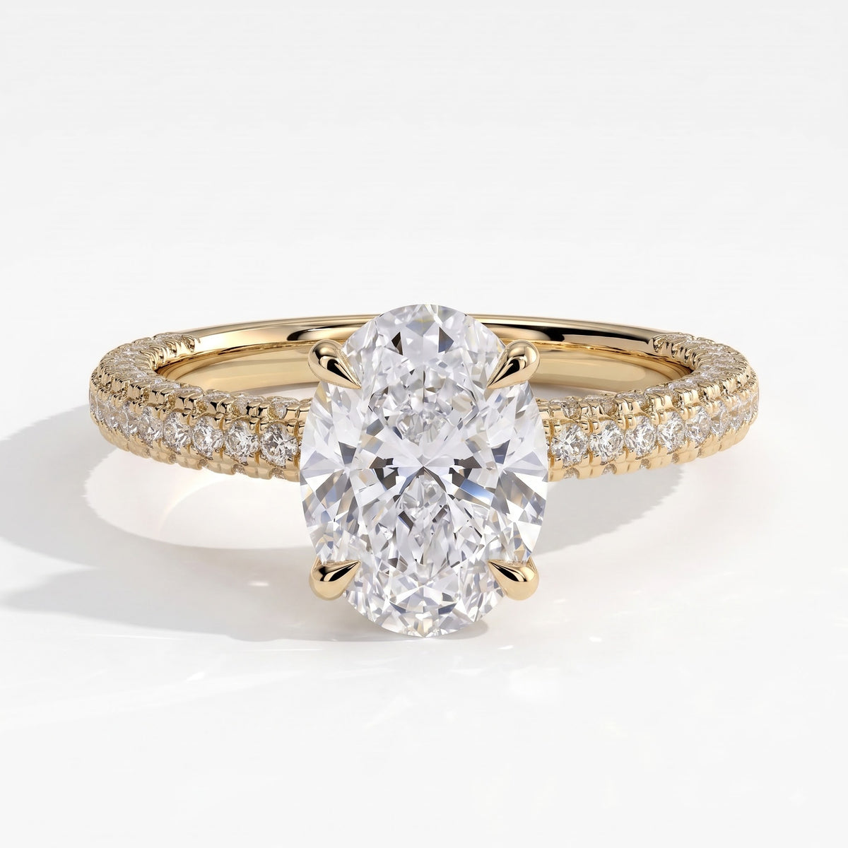 Oval lab-grown diamond halo engagement ring in 18K (750) yellow gold, front view