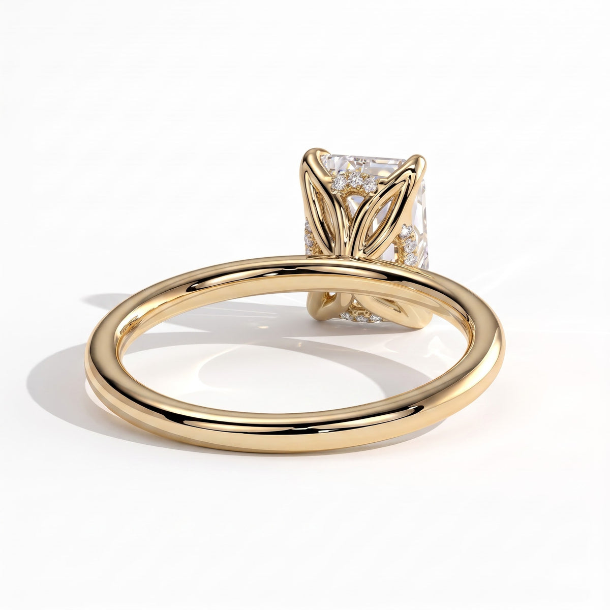 Emerald lab-grown diamond solitaire engagement ring in 18K (750) yellow gold, on white background