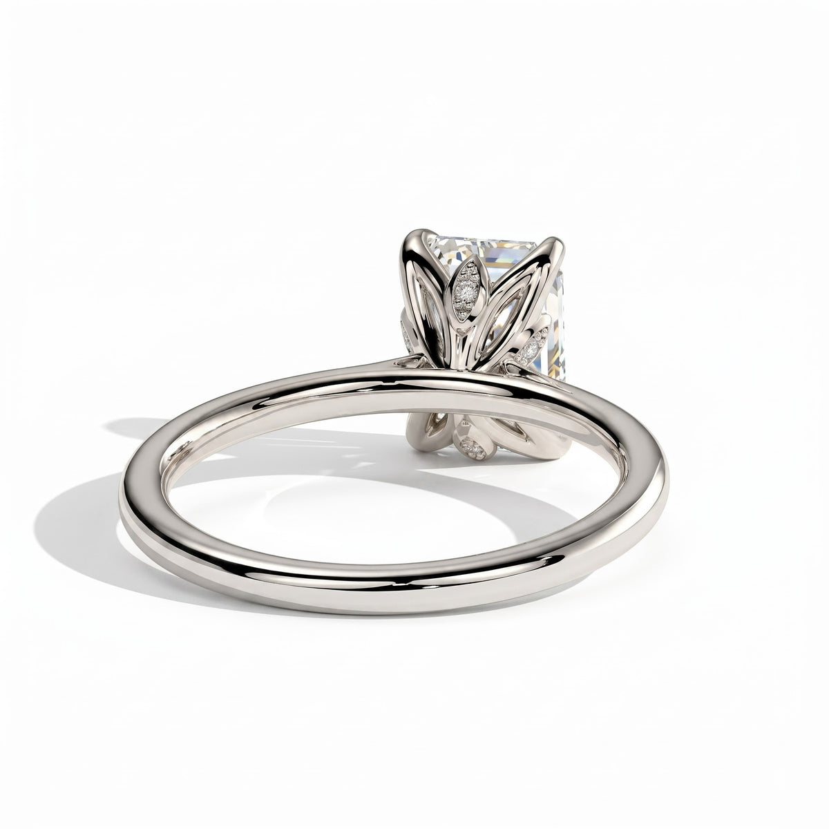 Emerald lab-grown diamond halo engagement ring in 14K (585) white gold, on white background