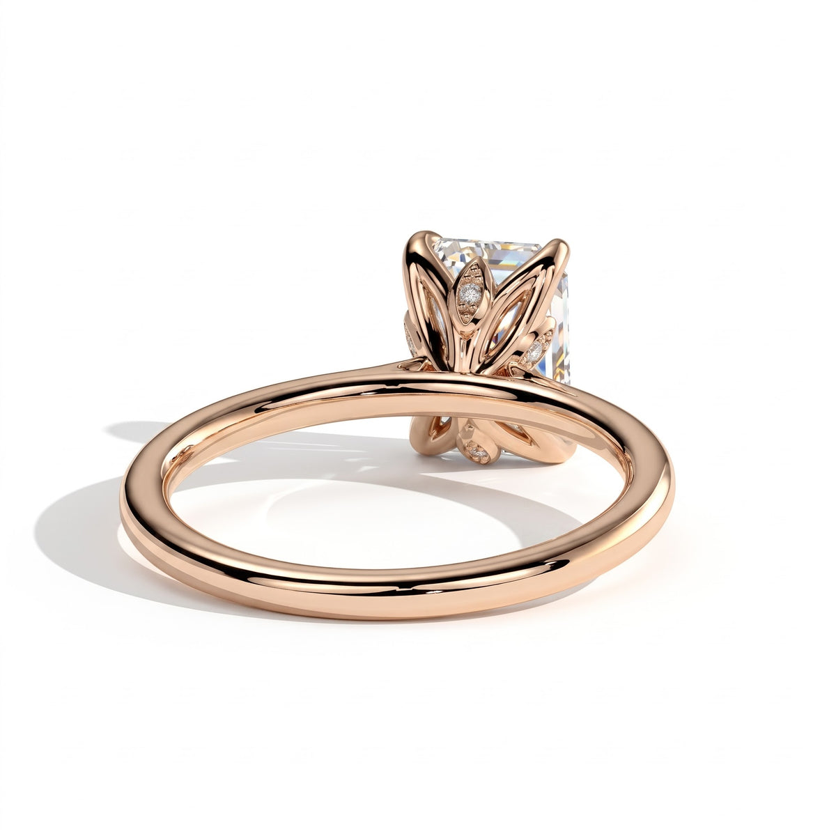 Emerald lab-grown diamond halo engagement ring in 18K (750) rose gold, on white background