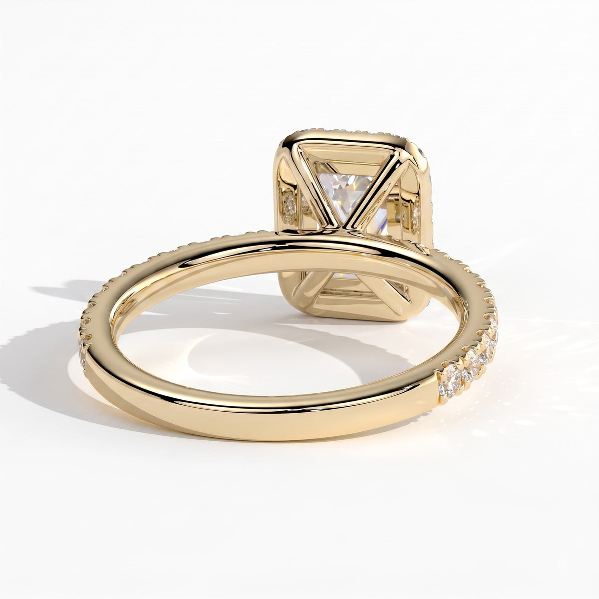 Emerald lab-grown diamond halo engagement ring in 14K (585) yellow gold, on white background