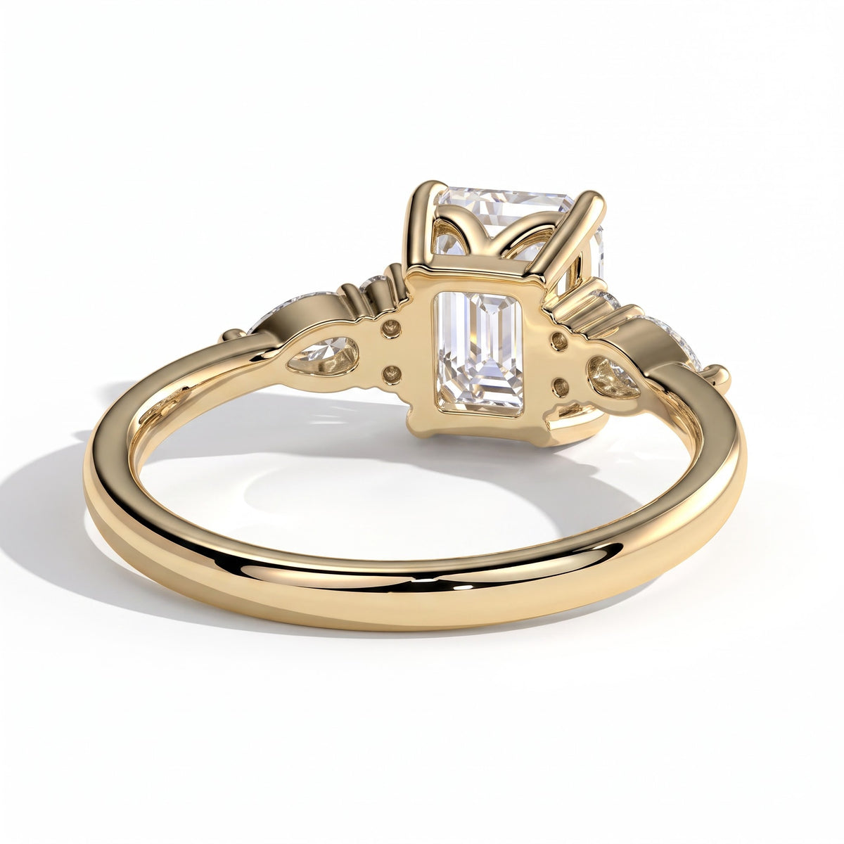 Emerald lab-grown diamond halo engagement ring in 14K (585) yellow gold, on white background