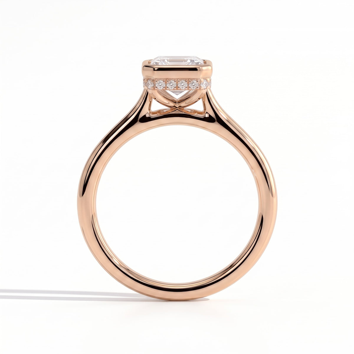 Emerald lab-grown diamond bezel-set halo engagement ring in 18K (750) rose gold, side profile