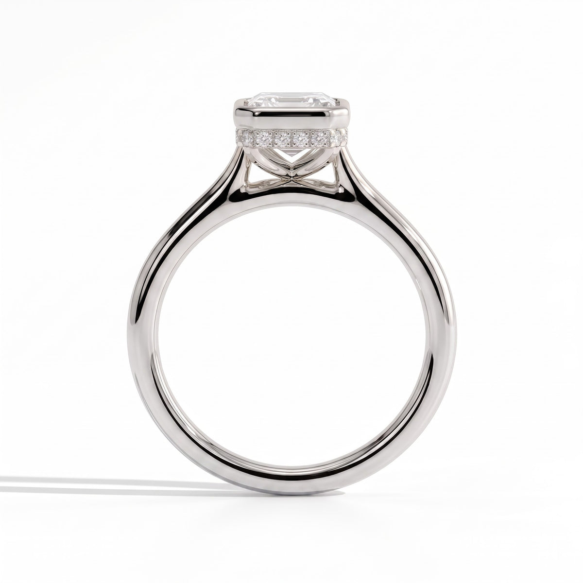 Emerald lab-grown diamond bezel-set halo engagement ring in 18K (750) white gold, side profile