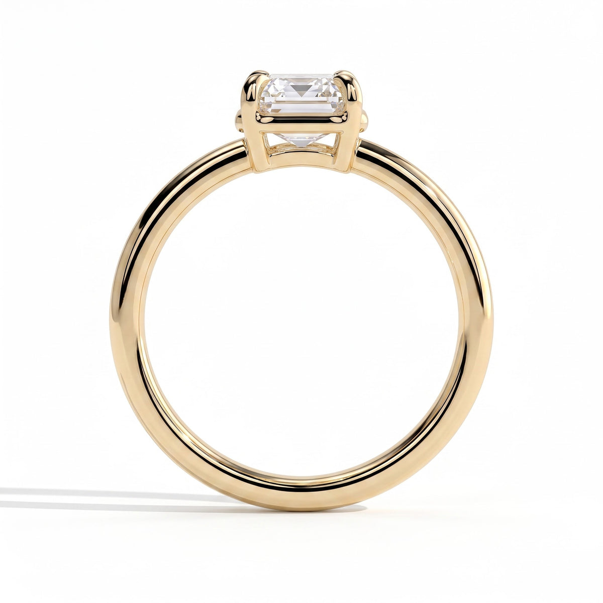 Emerald lab-grown diamond bezel-set solitaire engagement ring in 18K (750) yellow gold, side profile