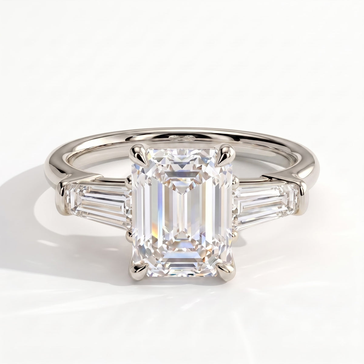 Emerald lab-grown diamond three-stone engagement ring in 950 platinum, front view