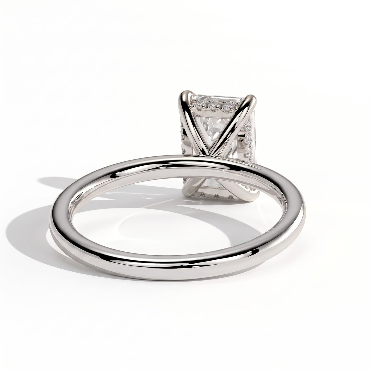 Emerald lab-grown diamond solitaire engagement ring in 18K (750) white gold, on white background