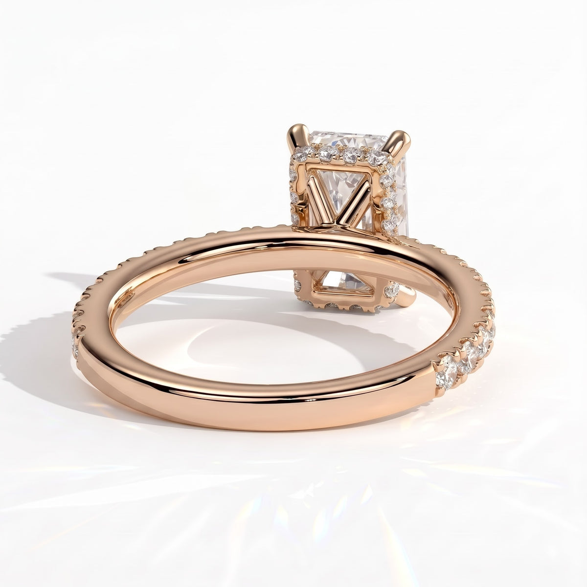 Radiant lab-grown diamond halo engagement ring in 14K (585) rose gold, on white background