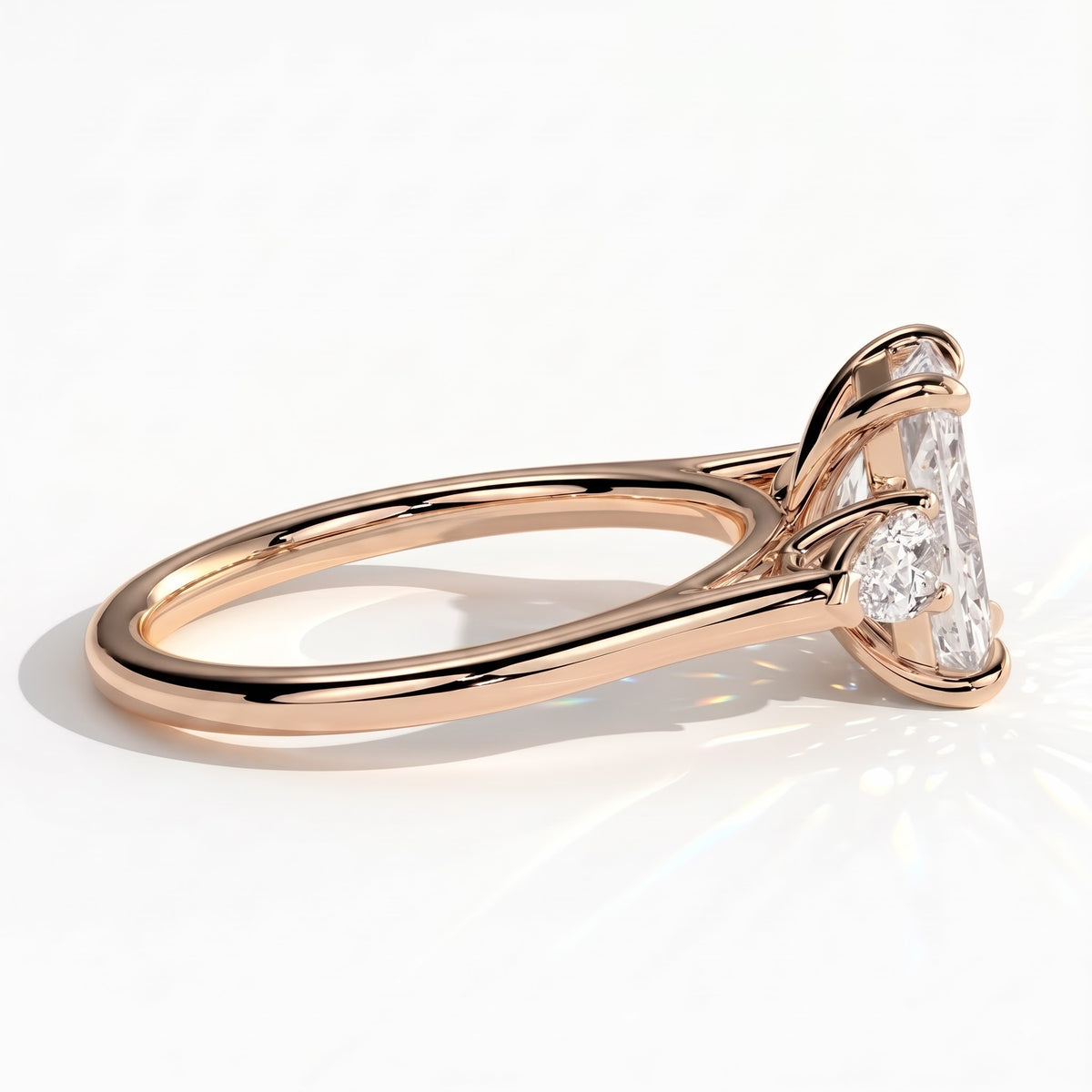 Radiant lab-grown diamond three-stone engagement ring in 18K (750) rose gold, detail view