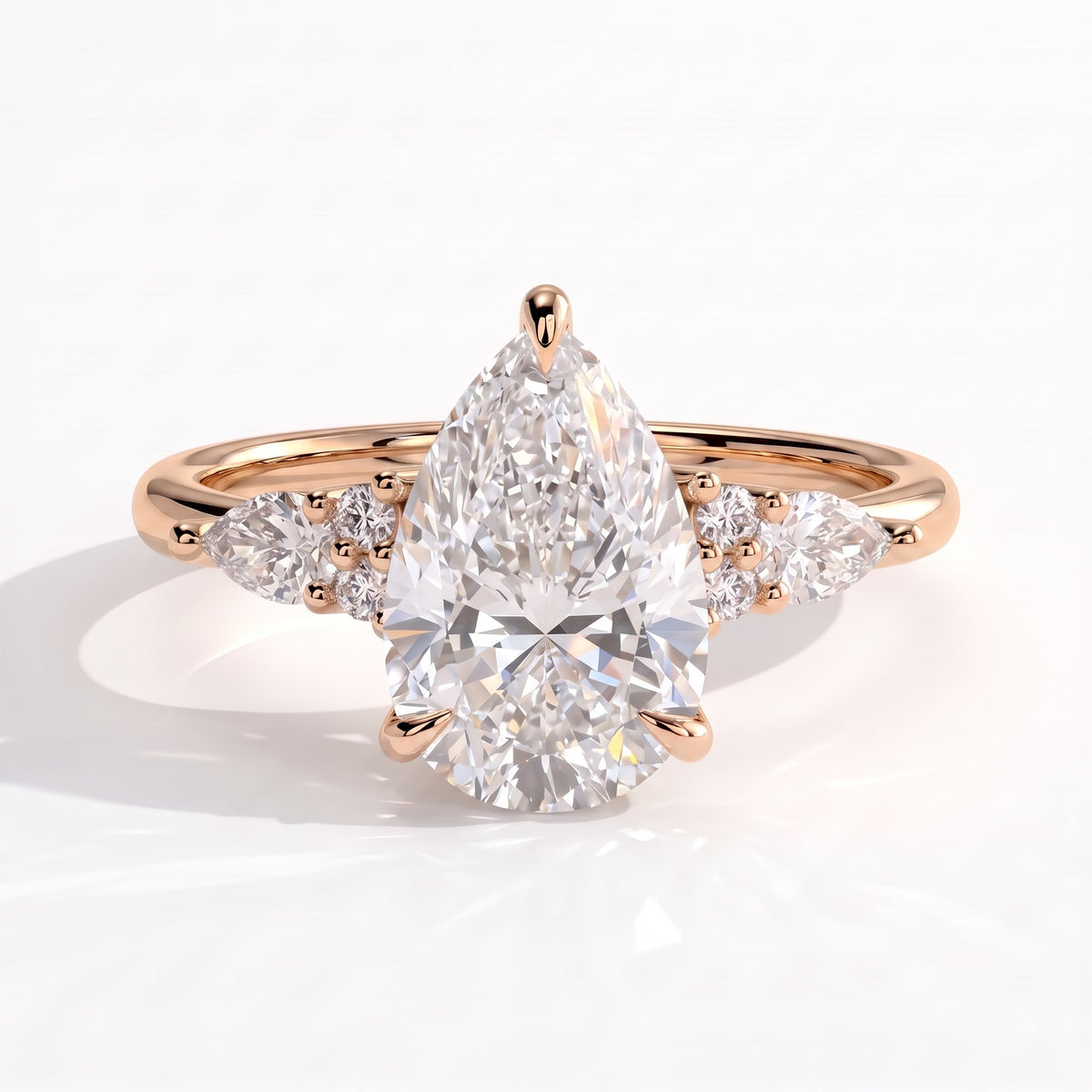 Pear lab-grown diamond halo engagement ring in 14K (585) rose gold, front view